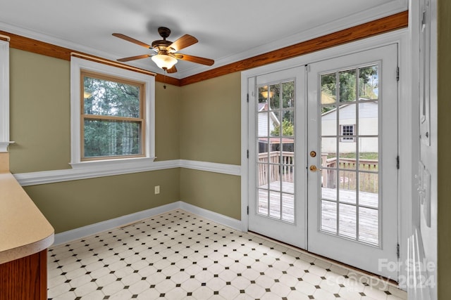 entryway featuring ornamental molding, ceiling fan, and french doors