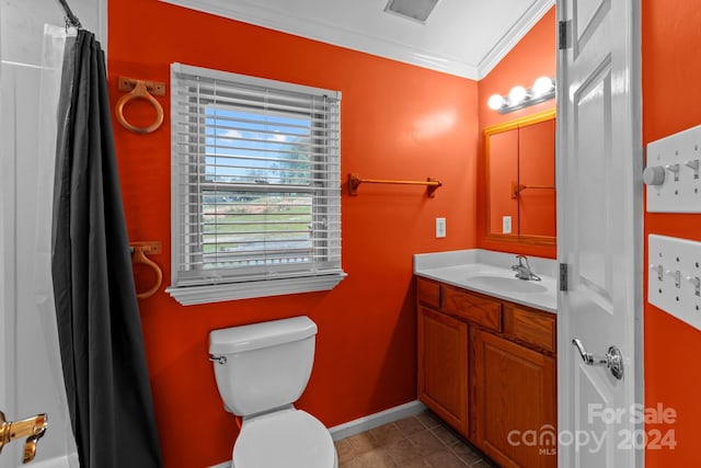 bathroom with walk in shower, tile patterned floors, ornamental molding, vanity, and toilet