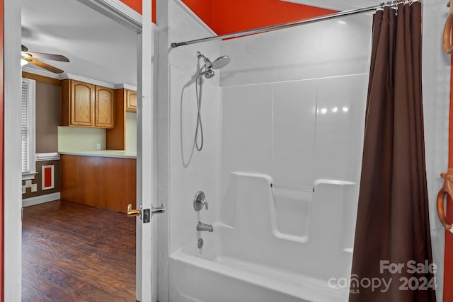 bathroom with shower / tub combo with curtain, ceiling fan, and hardwood / wood-style flooring