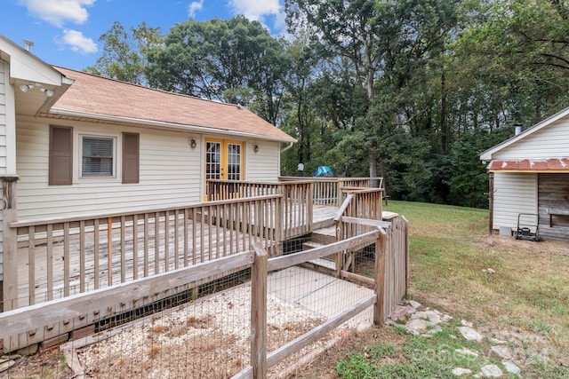 wooden terrace with a lawn