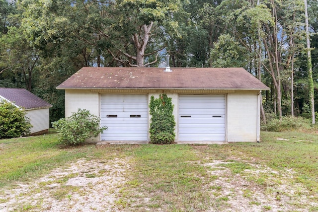 garage featuring a yard