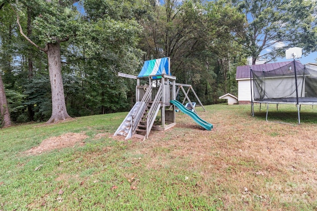 view of jungle gym featuring a trampoline and a lawn