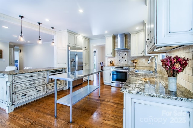 kitchen featuring white cabinetry, sink, stainless steel appliances, and wall chimney exhaust hood