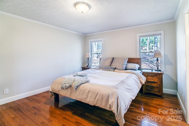 bedroom featuring ornamental molding, a textured ceiling, and dark hardwood / wood-style flooring