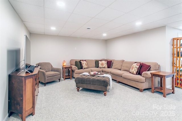 living room with light carpet and a drop ceiling