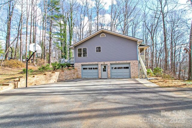 view of side of home featuring a garage