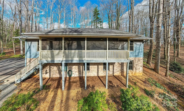 view of front of house with a sunroom