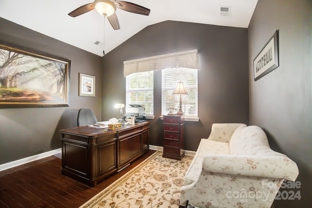 office space featuring ceiling fan, baseboards, lofted ceiling, dark wood-style flooring, and visible vents