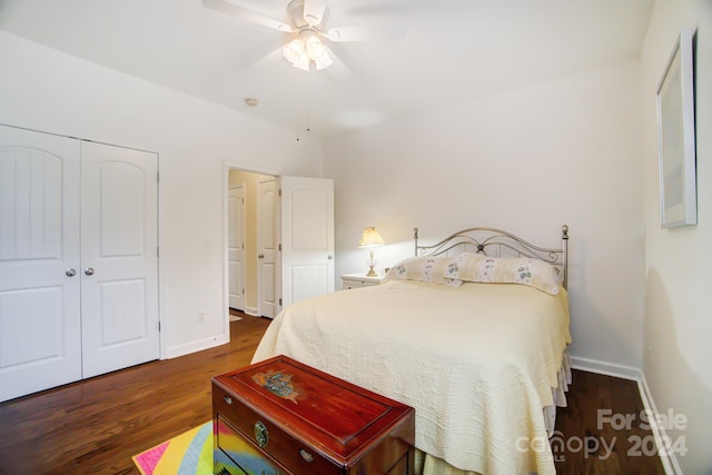 bedroom featuring a ceiling fan, baseboards, a closet, and dark wood finished floors