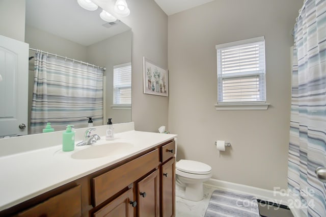 full bath featuring baseboards, visible vents, vanity, and toilet