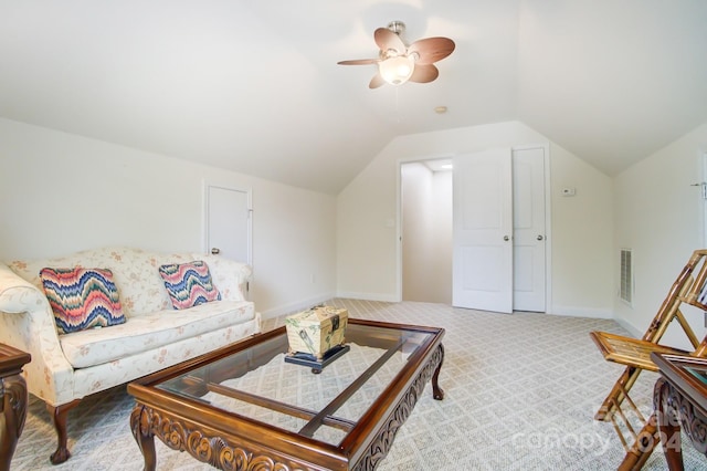 living area featuring ceiling fan, baseboards, lofted ceiling, carpet flooring, and visible vents
