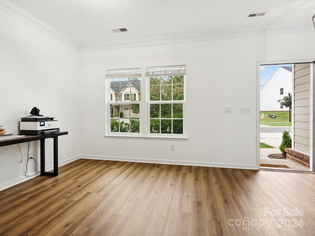 interior space featuring ornamental molding and hardwood / wood-style floors