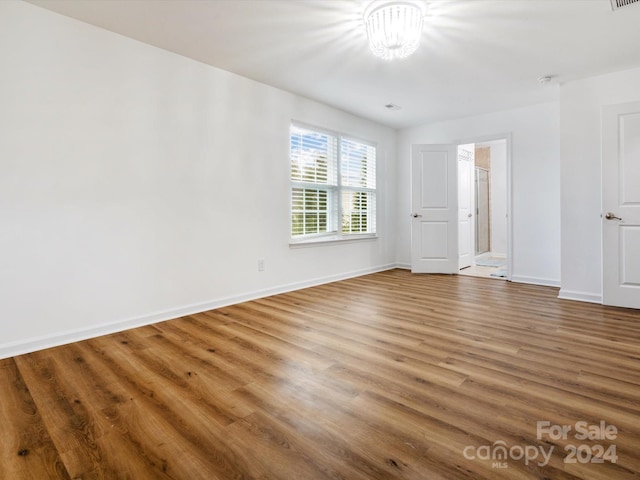 spare room featuring hardwood / wood-style flooring