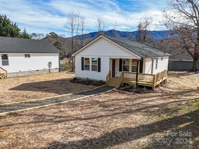 view of front facade with a mountain view and covered porch