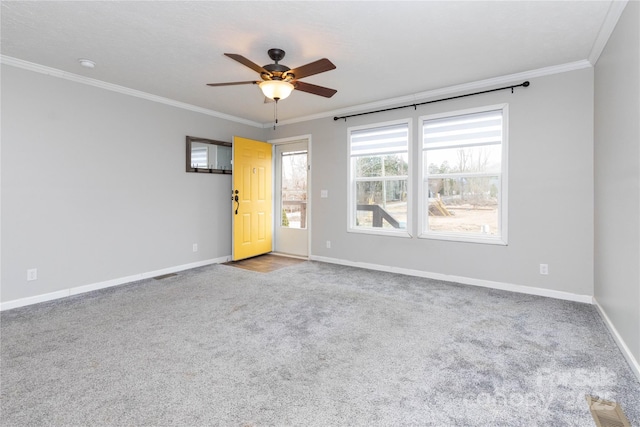 carpeted empty room with crown molding and ceiling fan