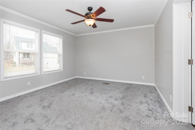 spare room with ornamental molding, carpet flooring, and ceiling fan