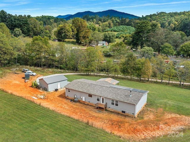 birds eye view of property featuring a mountain view