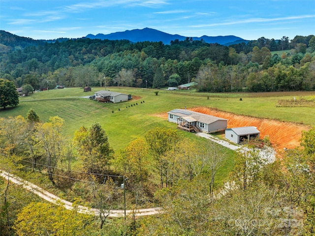 drone / aerial view featuring a mountain view and a rural view