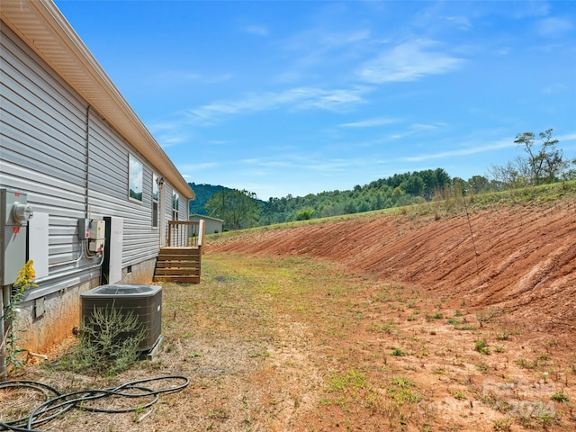 view of yard with central air condition unit