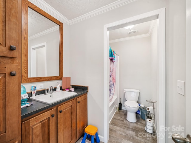 full bathroom with vanity, ornamental molding, shower / bath combo, wood-type flooring, and toilet