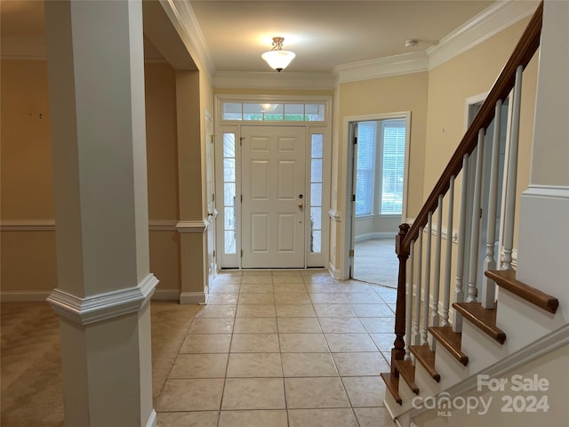 entryway featuring crown molding and light colored carpet