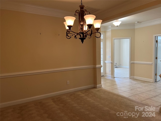 carpeted empty room featuring a notable chandelier and ornamental molding