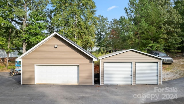 garage featuring wooden walls