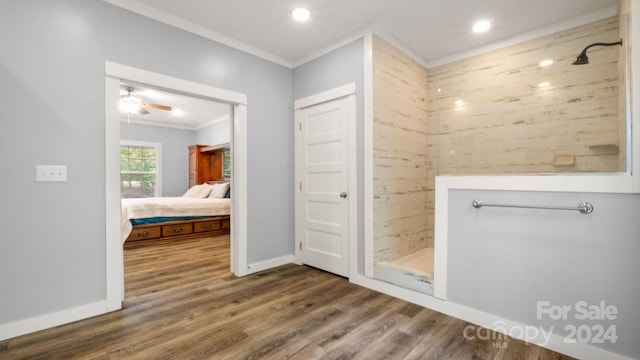 bathroom with hardwood / wood-style flooring, walk in shower, ceiling fan, and crown molding