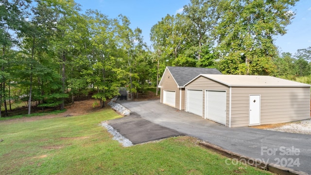 garage with a yard