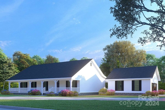 view of front of house with covered porch and a front yard