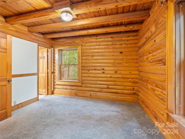 spare room featuring beamed ceiling, wood ceiling, carpet flooring, and log walls