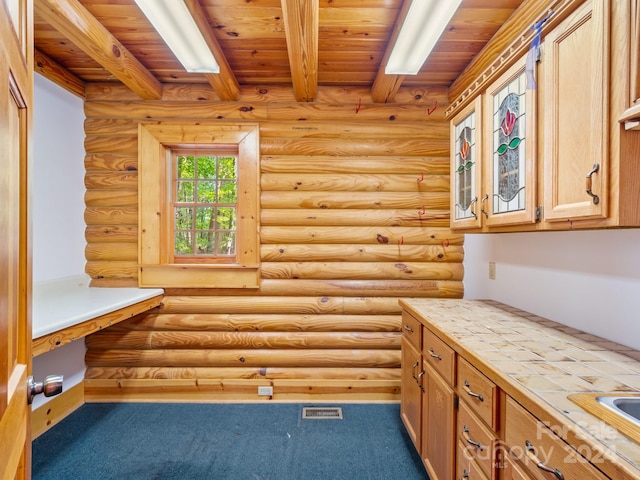 interior space with wood ceiling and rustic walls