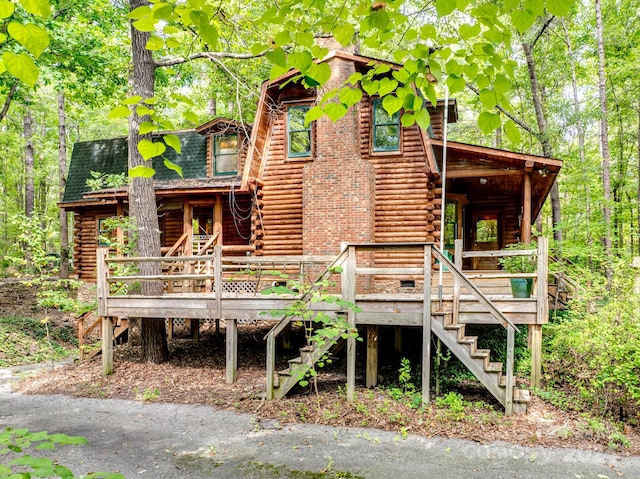 rear view of property with covered porch