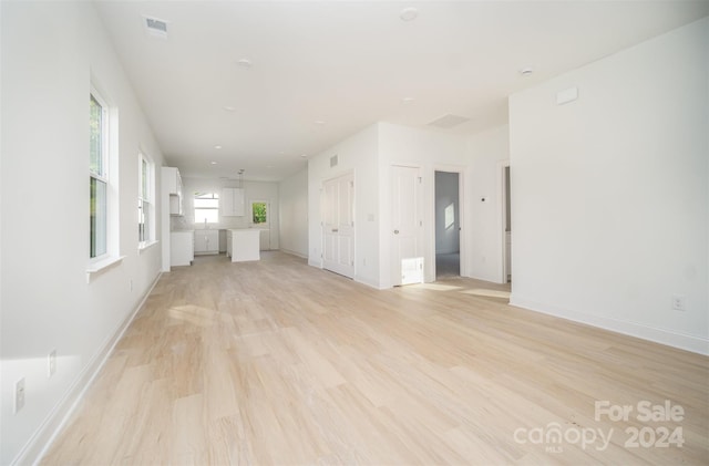 unfurnished living room with light hardwood / wood-style floors