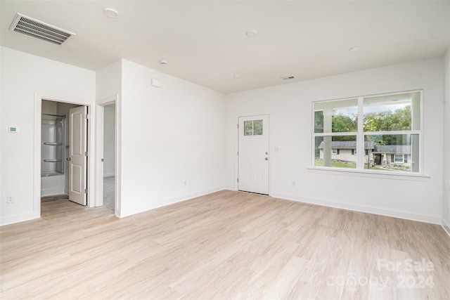 spare room featuring light hardwood / wood-style floors