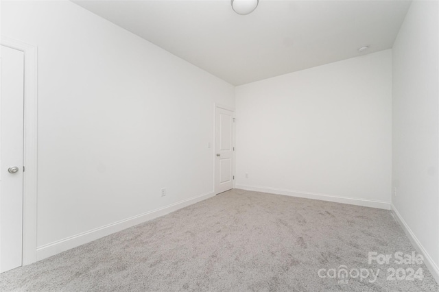 empty room featuring carpet floors