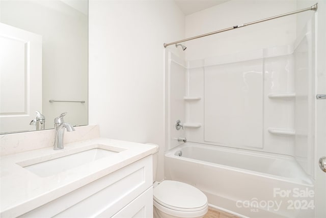 full bathroom with toilet, vanity, and  shower combination