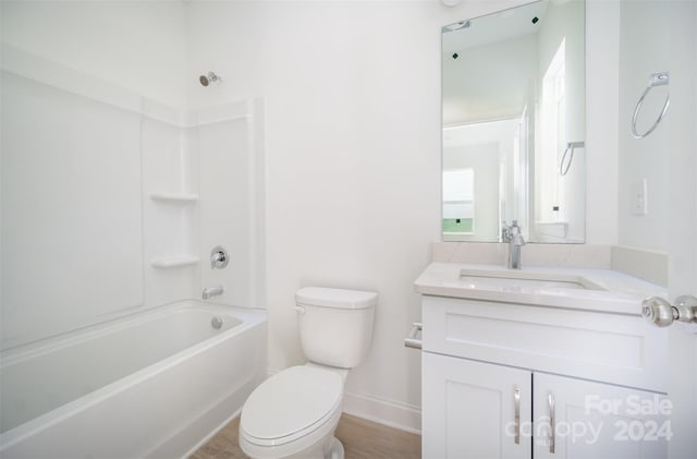 full bathroom featuring toilet, vanity, and shower / bathtub combination