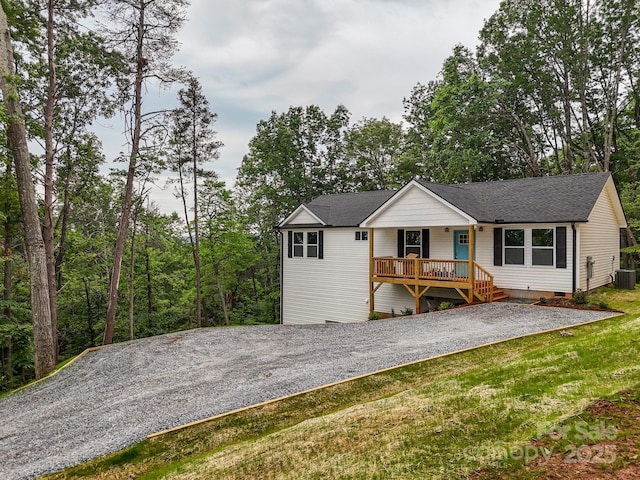 376 Hague Dr, Columbus, NC 28722 - ranch-style house with crawl space, a shingled roof, a porch, a front yard, and driveway