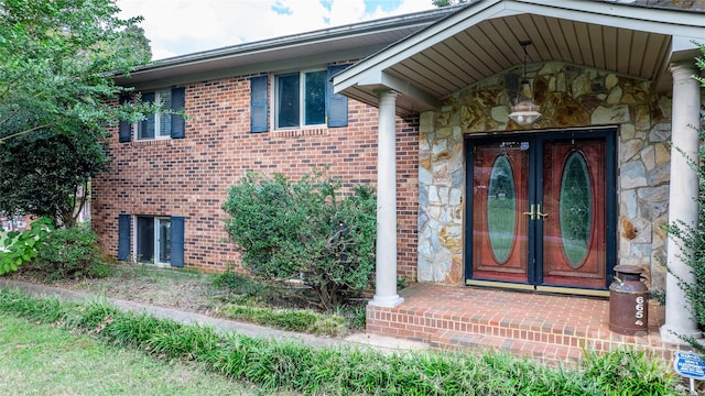 property entrance featuring french doors