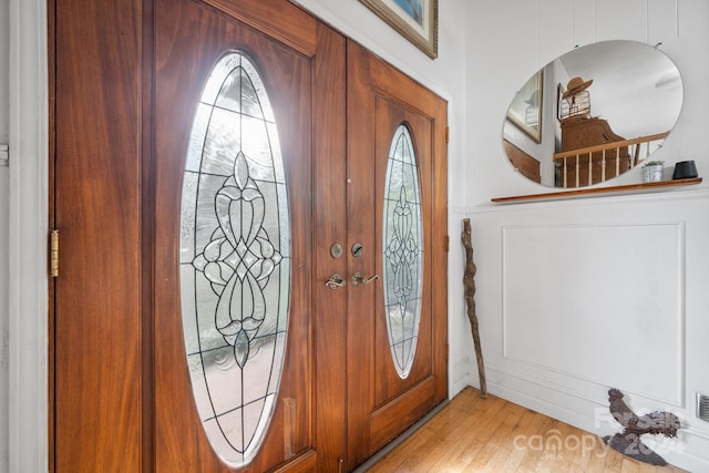 entrance foyer featuring a wealth of natural light and light hardwood / wood-style floors