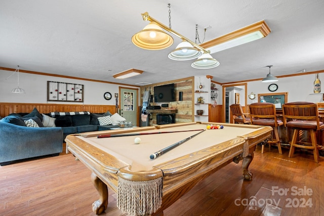 game room featuring wood walls, wood-type flooring, and billiards