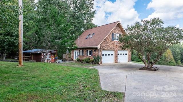 view of front of home with a garage and a front yard