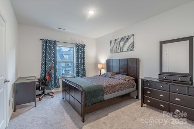 bedroom with light carpet