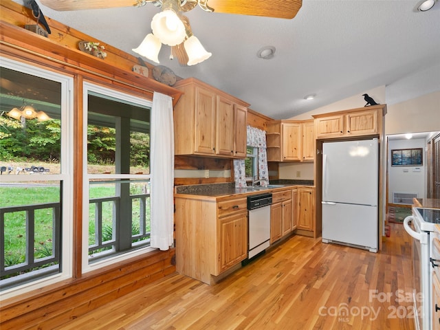 229 Medford Hannah Rd, Waynesville, NC 28785 - kitchen featuring white appliances, dark countertops, vaulted ceiling, healthy amount of natural light, and light wood-style flooring