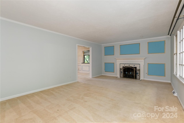 unfurnished living room with ornamental molding and light carpet