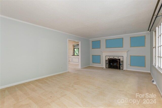 1010 Indian Hill Rd, Hendersonville, NC 28791 - unfurnished living room with crown molding, carpet flooring, a fireplace with flush hearth, and baseboards