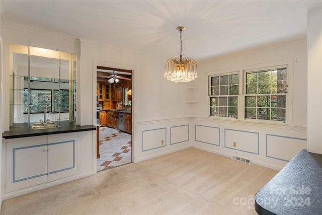 1010 Indian Hill Rd, Hendersonville, NC 28791 - unfurnished dining area featuring a chandelier, ornamental molding, a sink, carpet, and a decorative wall