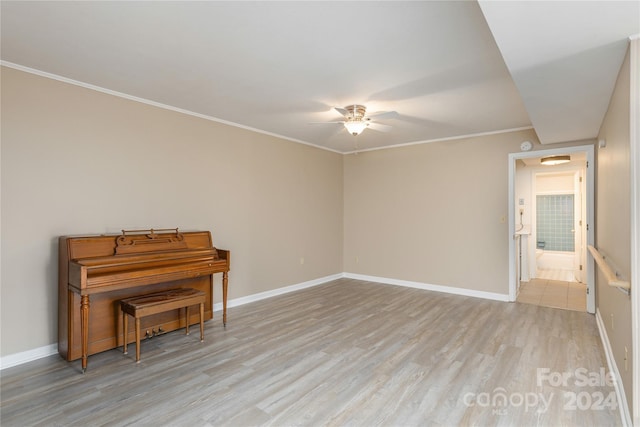 miscellaneous room featuring ceiling fan, light hardwood / wood-style floors, and ornamental molding