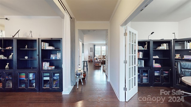 hallway with ornamental molding and dark wood-type flooring